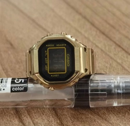 gold Casio ring watch